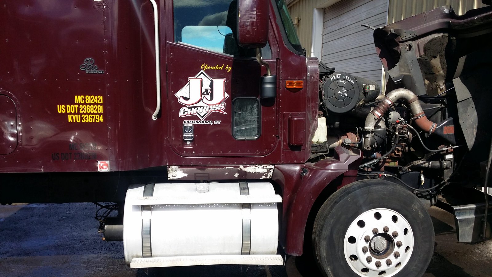 J&J Express custom truck door lettering with USDOT and MC numbers